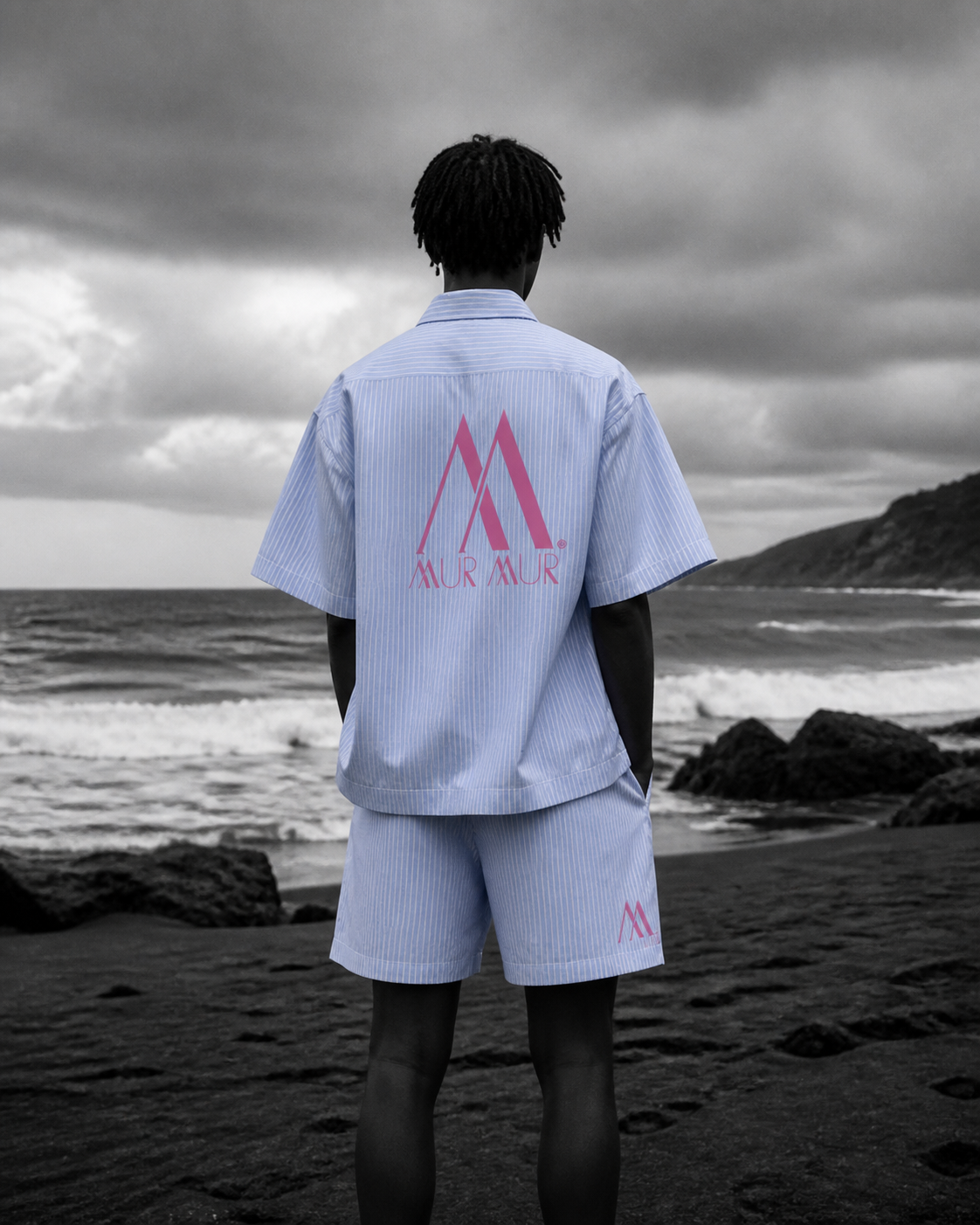 Model wearing the Mur Mur Cabana shirt and shorts, back view