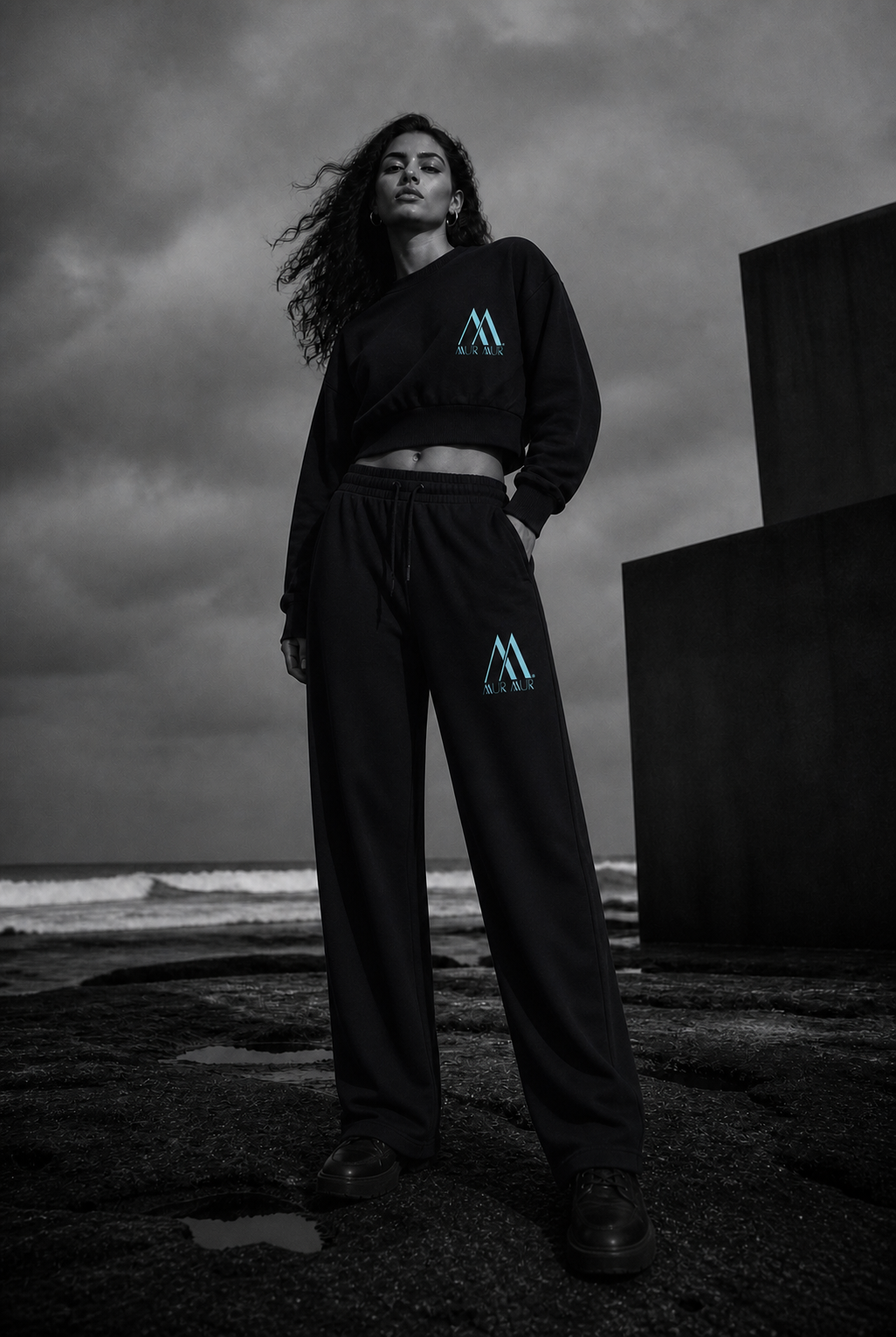 Woman wearing the matching blue-logo Mur Mur cropped sweatshirt and straight-leg pants