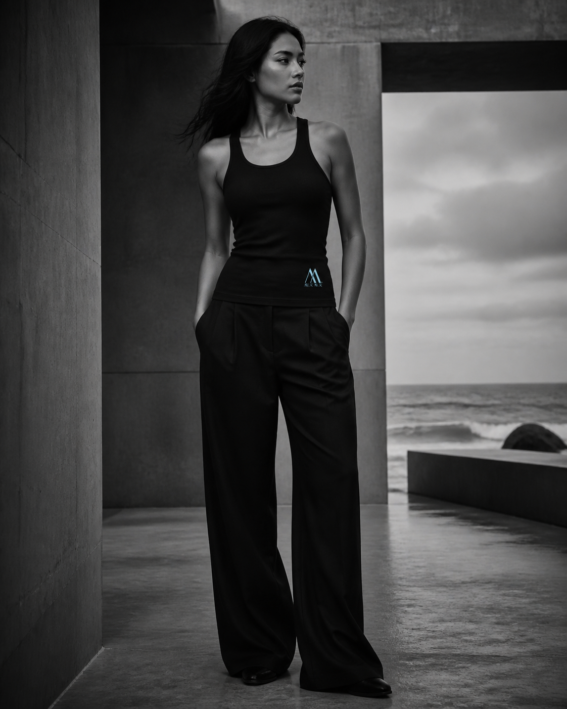 Woman wearing the Mur Mur ribbed racerback tank in seaside architecture